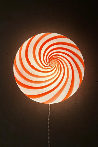 Murano ceiling lamp in red/white swirl pattern, round shape with glowing detail, gives a warm and inviting expression