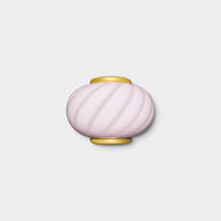 Murano wall lamp in soft pink with swirl pattern, round shape and golden details, ideal for modern interiors