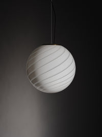 Murano pendant in white with swirl pattern, 40 cm, hanging in a dark room, elegant and modern design