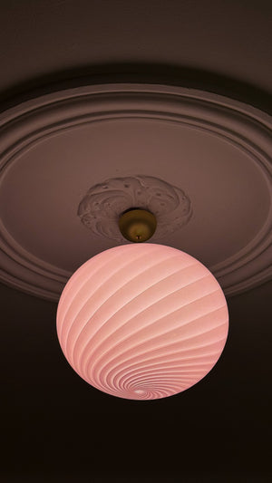large Murano pendant in bubble gum with swirl pattern, top-down view with ceiling details